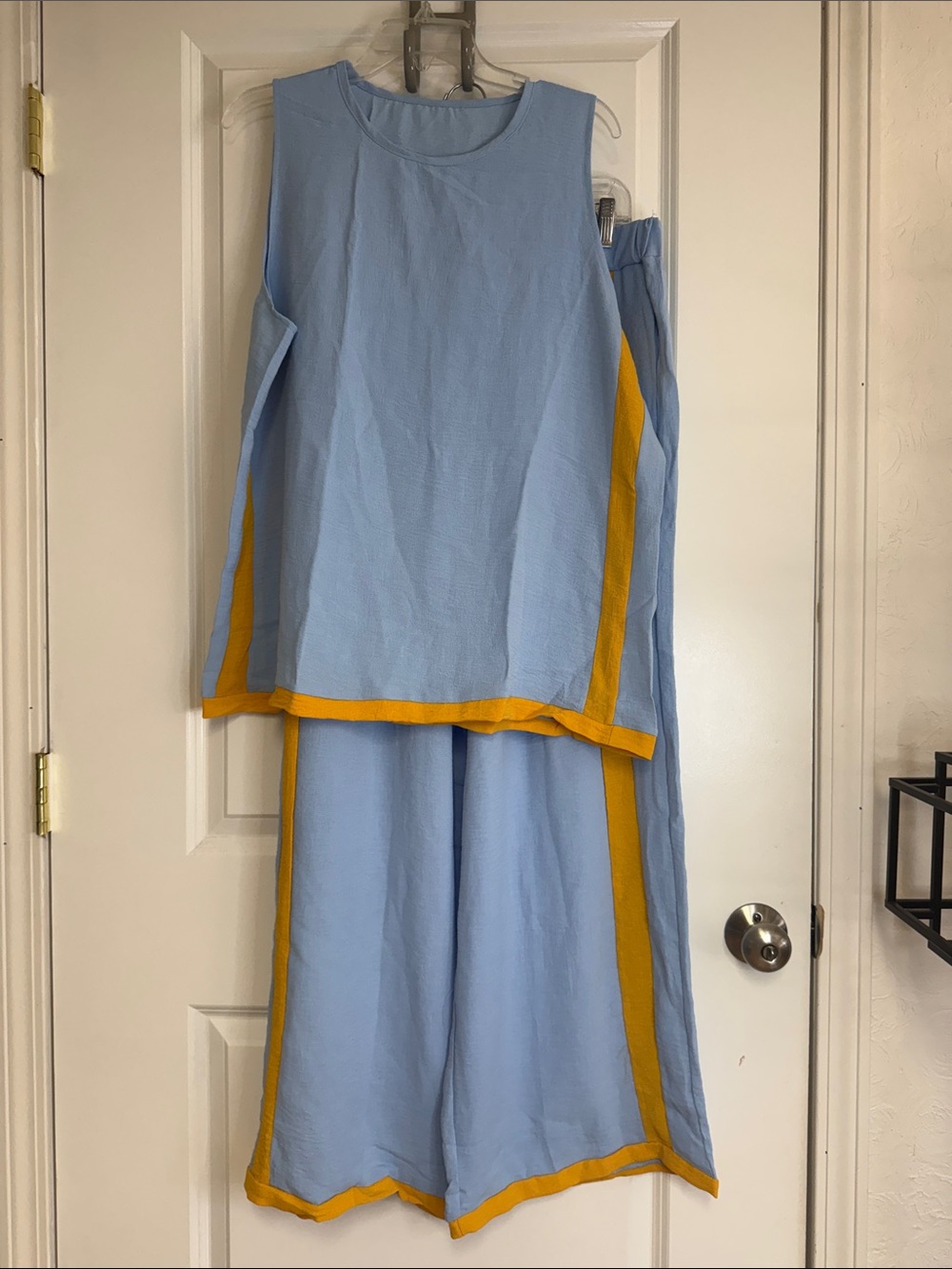 Amazon Light Blue Two-Piece Pantsuit with Yellow Trim